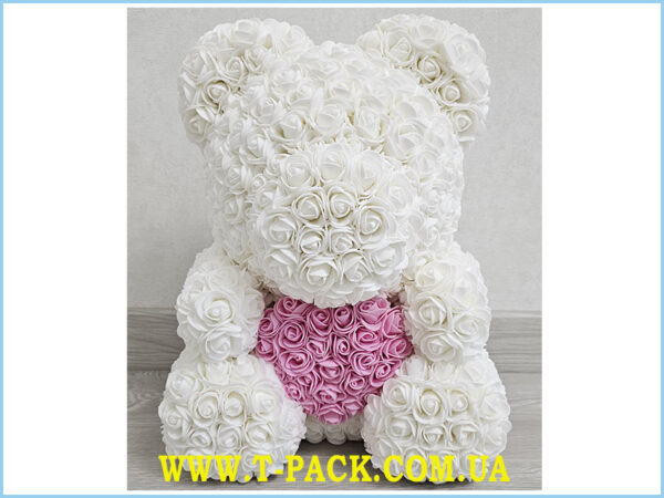 Snow white rose teddy bear with a pink heart