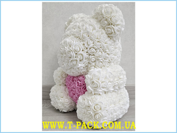 Snow white rose teddy bear with a heart