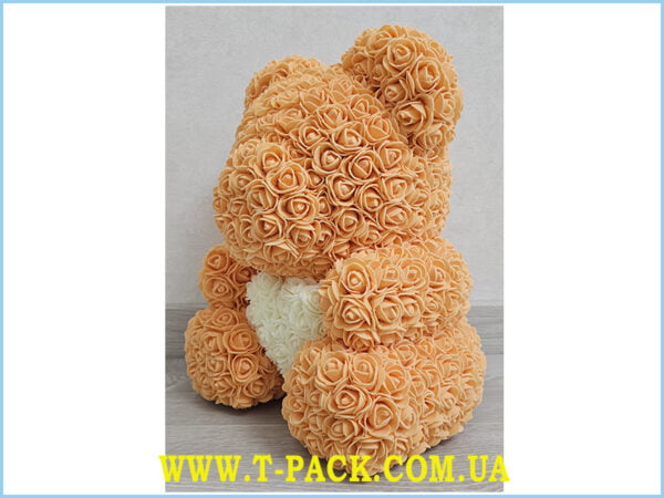 Orange rose teddy bear.